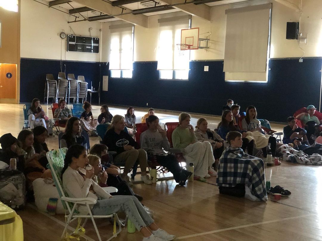 schoolers enjoyed a morning in the gym watching a movie